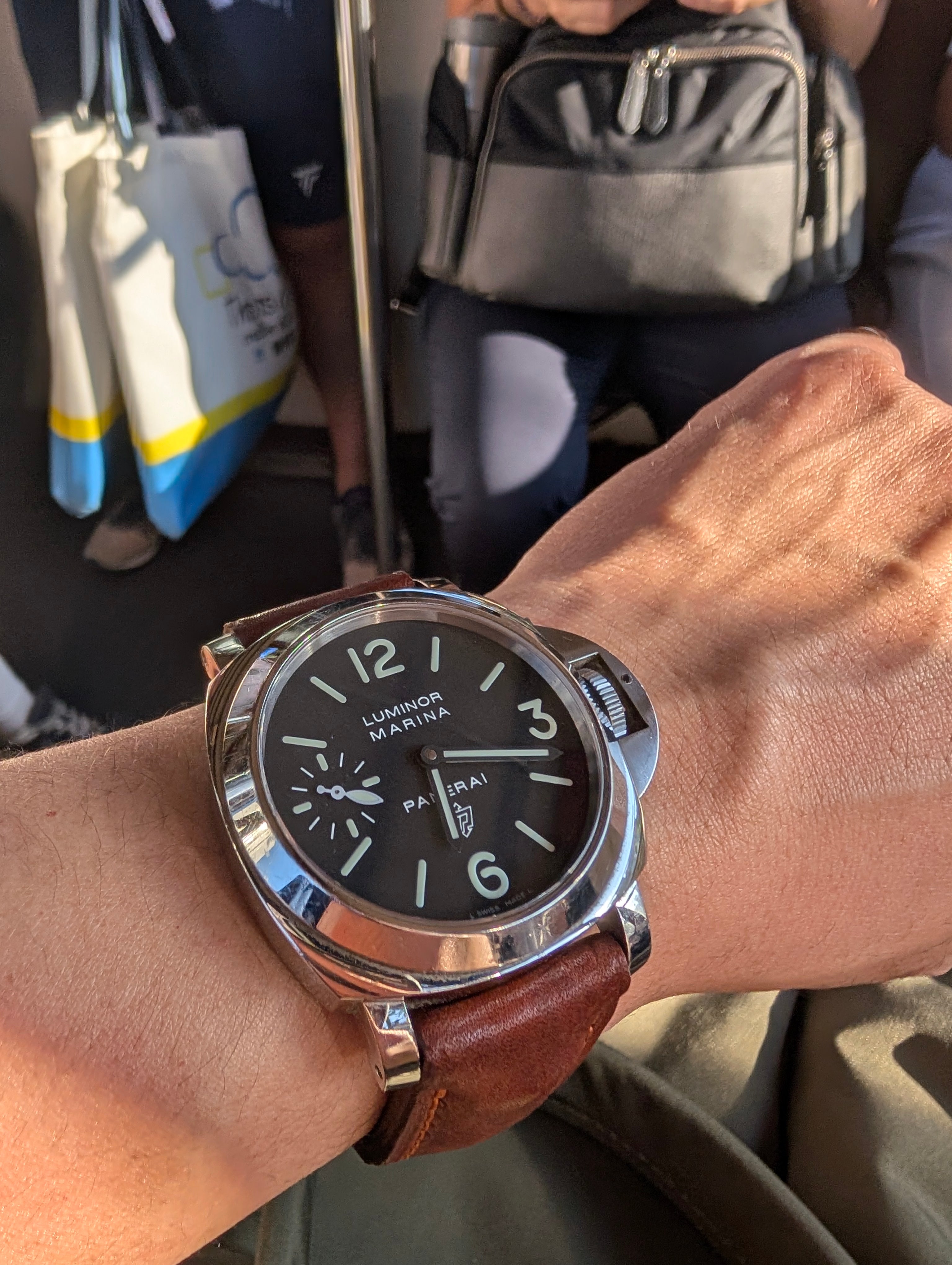 Vintage brown handmade leather watch strap mounted on a Panerai-style 24mm watch case.