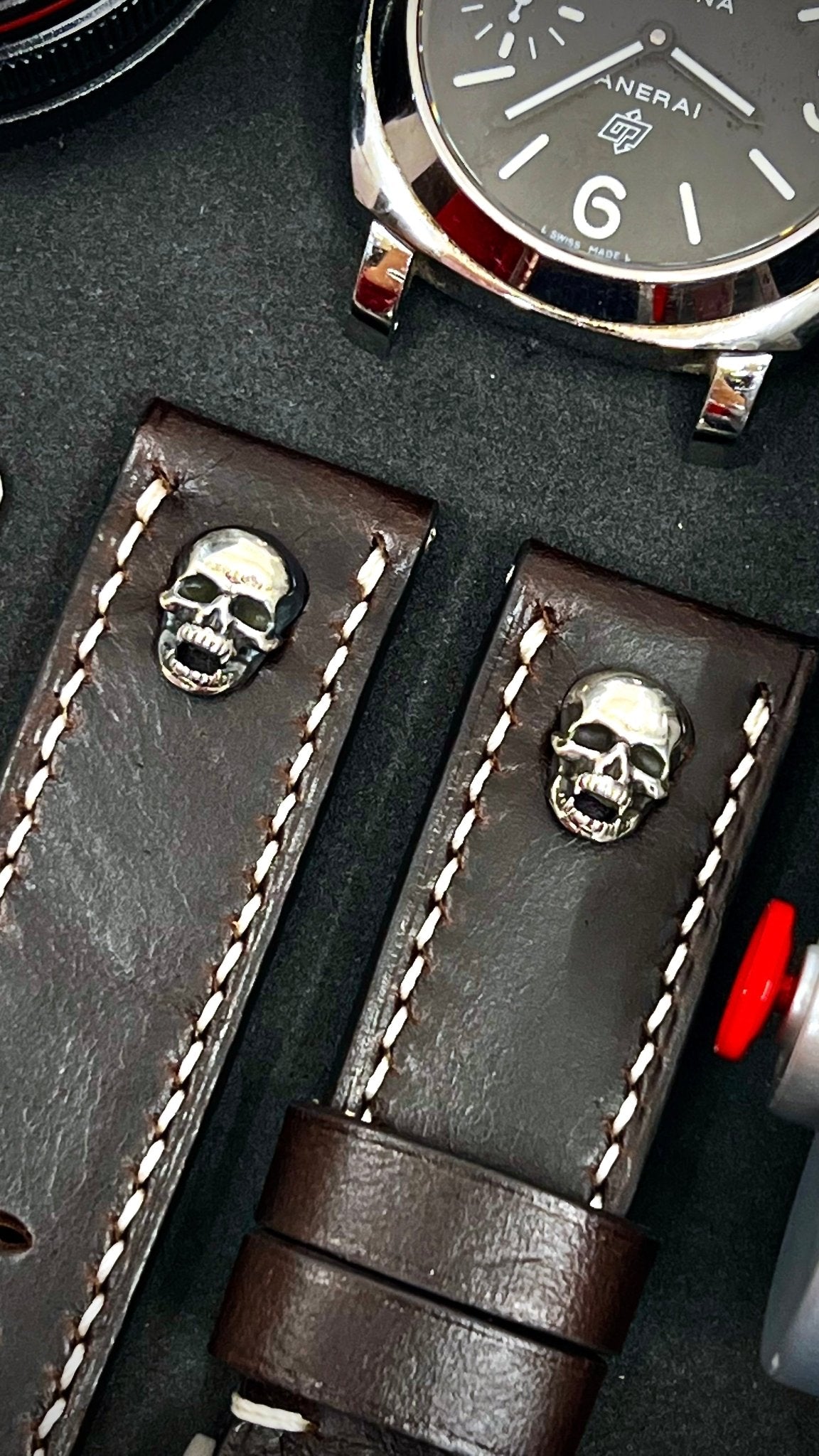 A touch of edge with our dark brown leather watch band & silver skull stud. Fits 24mm & 26mm lug width timepieces.